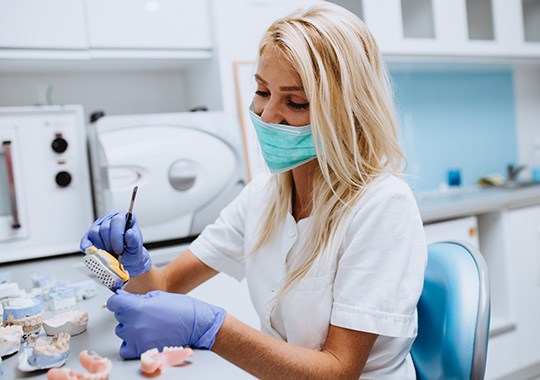 Lab technician making dentures