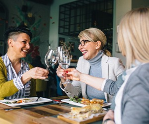 Group of women smiling at lunch 