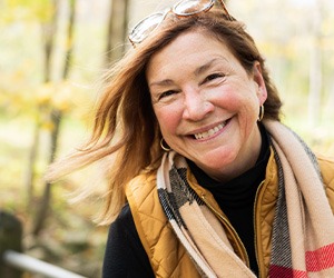 Older woman outside smiling